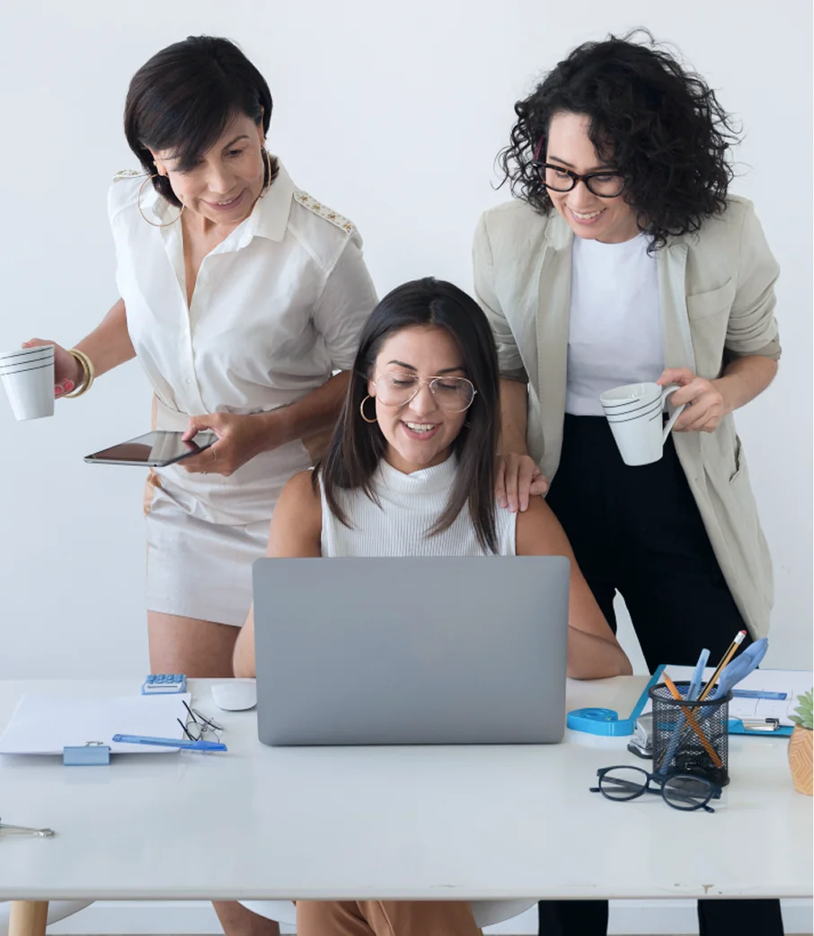 Business team reviewing company finances together on a laptop